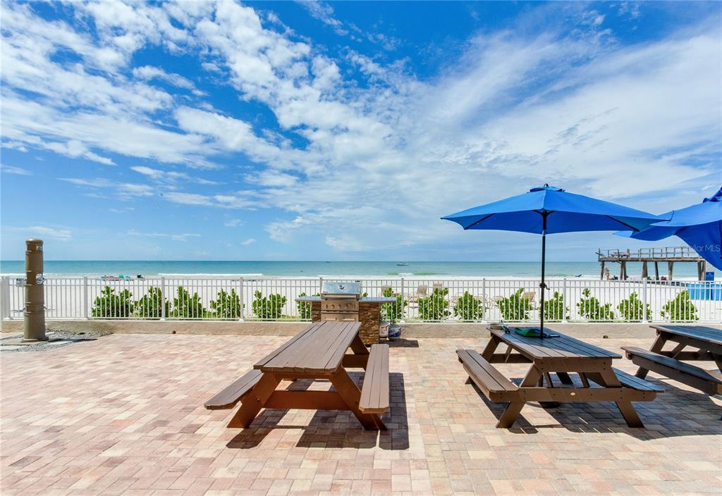 17450 Gulf Boulevard, Unit 206 Redington Shores, FL 33708 - Photo 48 of 52 a view of a chairs and table in patio