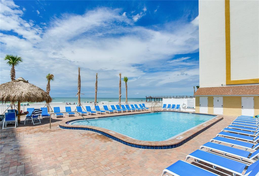 17450 Gulf Boulevard, Unit 206 Redington Shores, FL 33708 - Photo 50 of 52 a view of a swimming pool with chairs