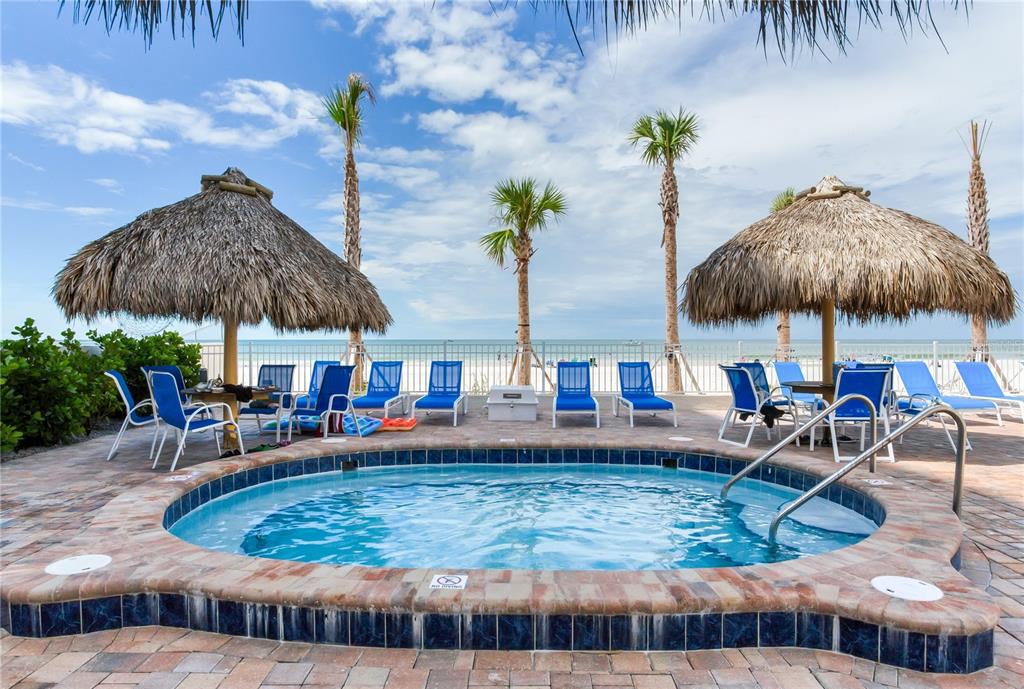 17450 Gulf Boulevard, Unit 206 Redington Shores, FL 33708 - Photo 51 of 52 an outdoor space with patio and umbrella