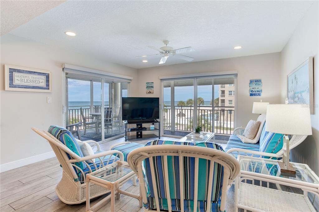 17450 Gulf Boulevard, Unit 206 Redington Shores, FL 33708 - Photo 10 of 52 a dining room with furniture window and wooden floor