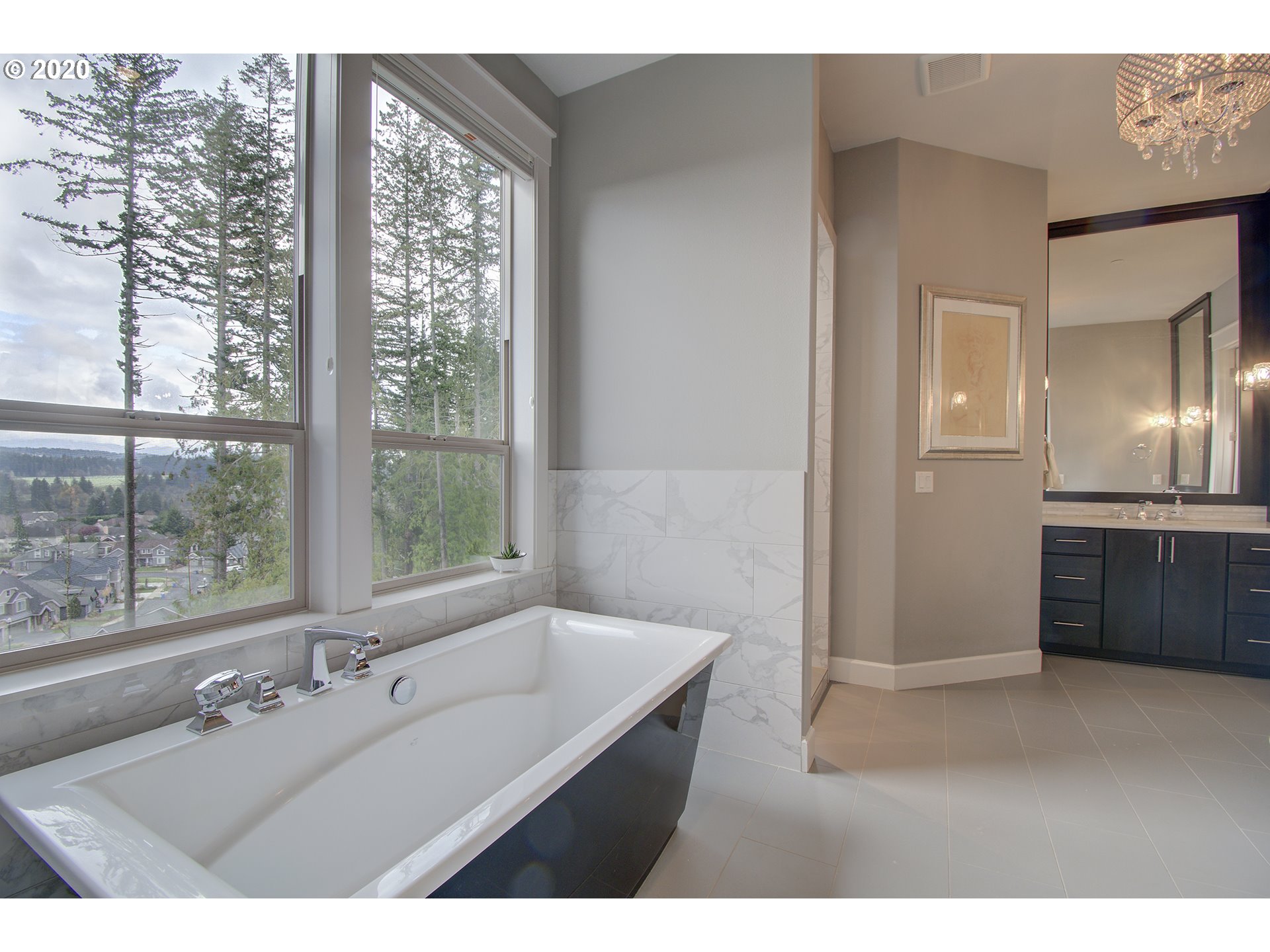 3221 Northwest Lake Place Camas, WA 98607 - Photo 14 of 32 a bathroom with a double vanity sink and a large mirror