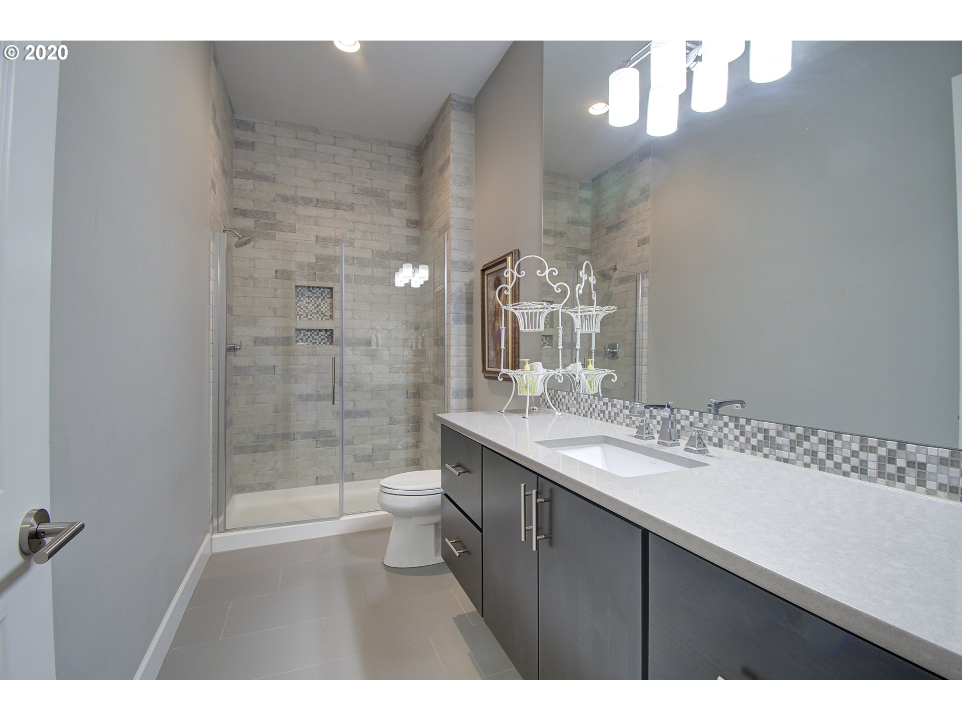 3221 Northwest Lake Place Camas, WA 98607 - Photo 19 of 32 a bathroom with a sink a toilet and shower