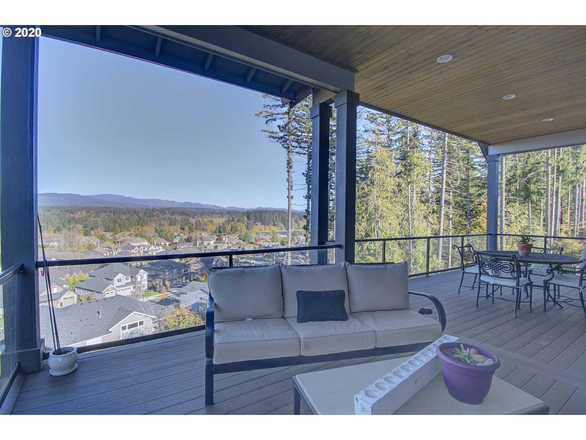 3221 Northwest Lake Place Camas, WA 98607 - Photo 30 of 32 a living room with furniture and a floor to ceiling window