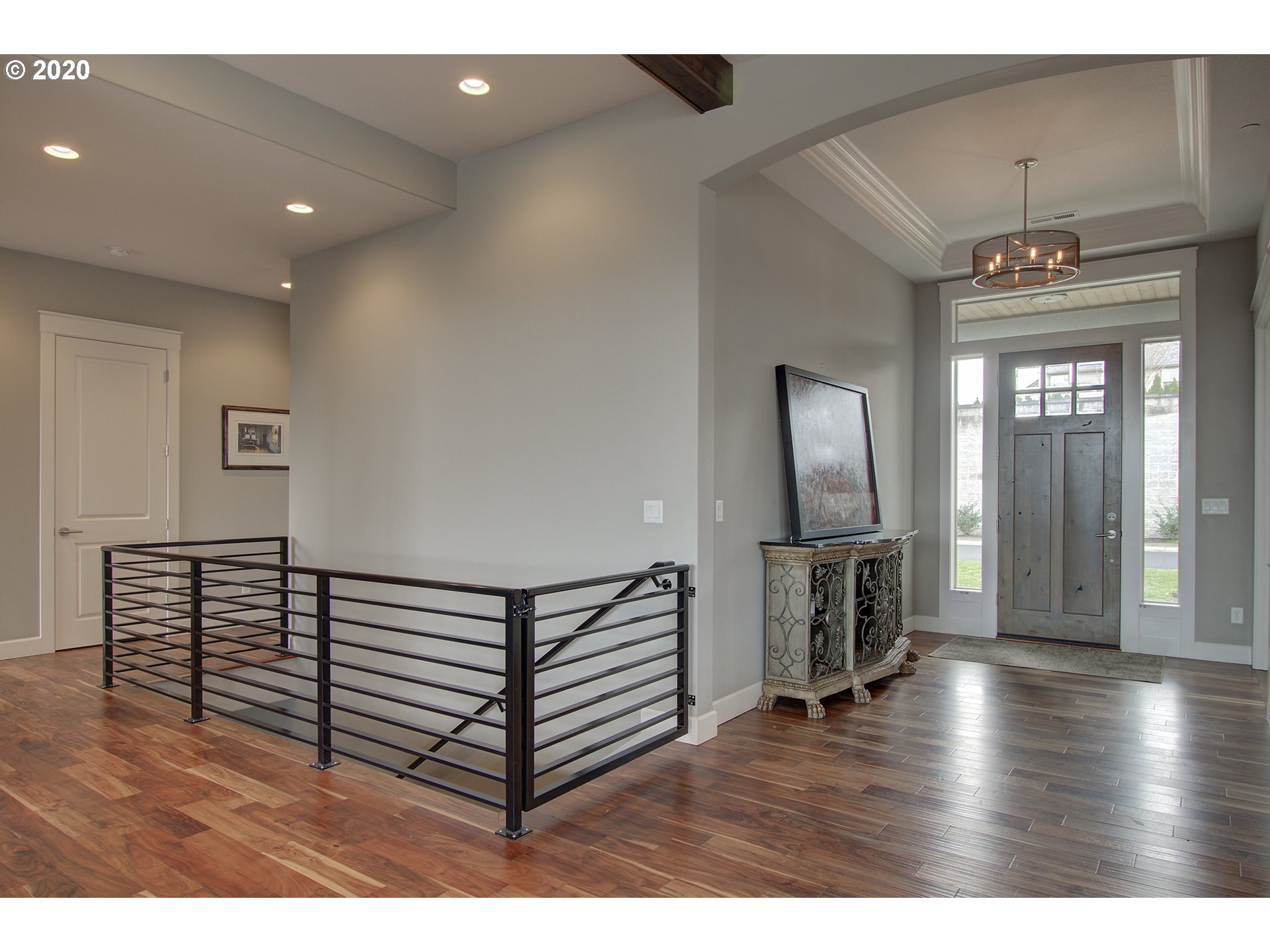 3221 Northwest Lake Place Camas, WA 98607 - Photo 4 of 32 a view of a livingroom with hardwood floor and a ceiling fan