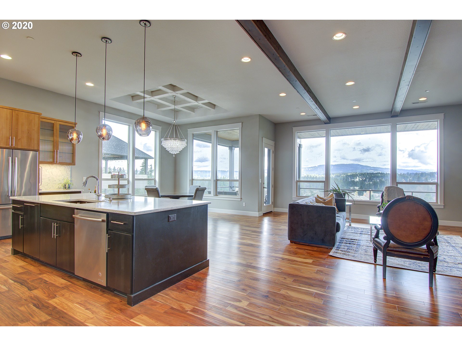 3221 Northwest Lake Place Camas, WA 98607 - Photo 5 of 32 a large kitchen with kitchen island granite countertop a large window and stainless steel appliances