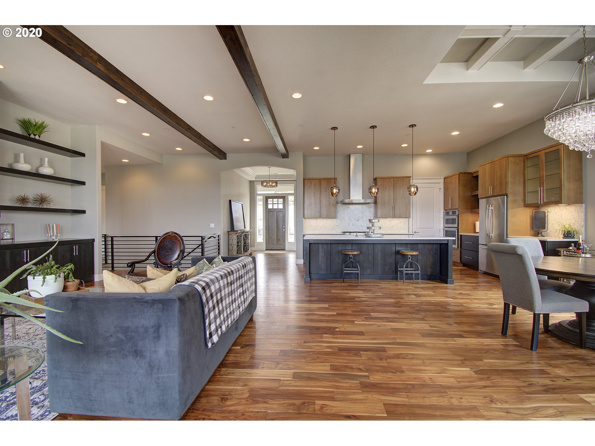 3221 Northwest Lake Place Camas, WA 98607 - Photo 8 of 32 a living room with kitchen island furniture and a kitchen view