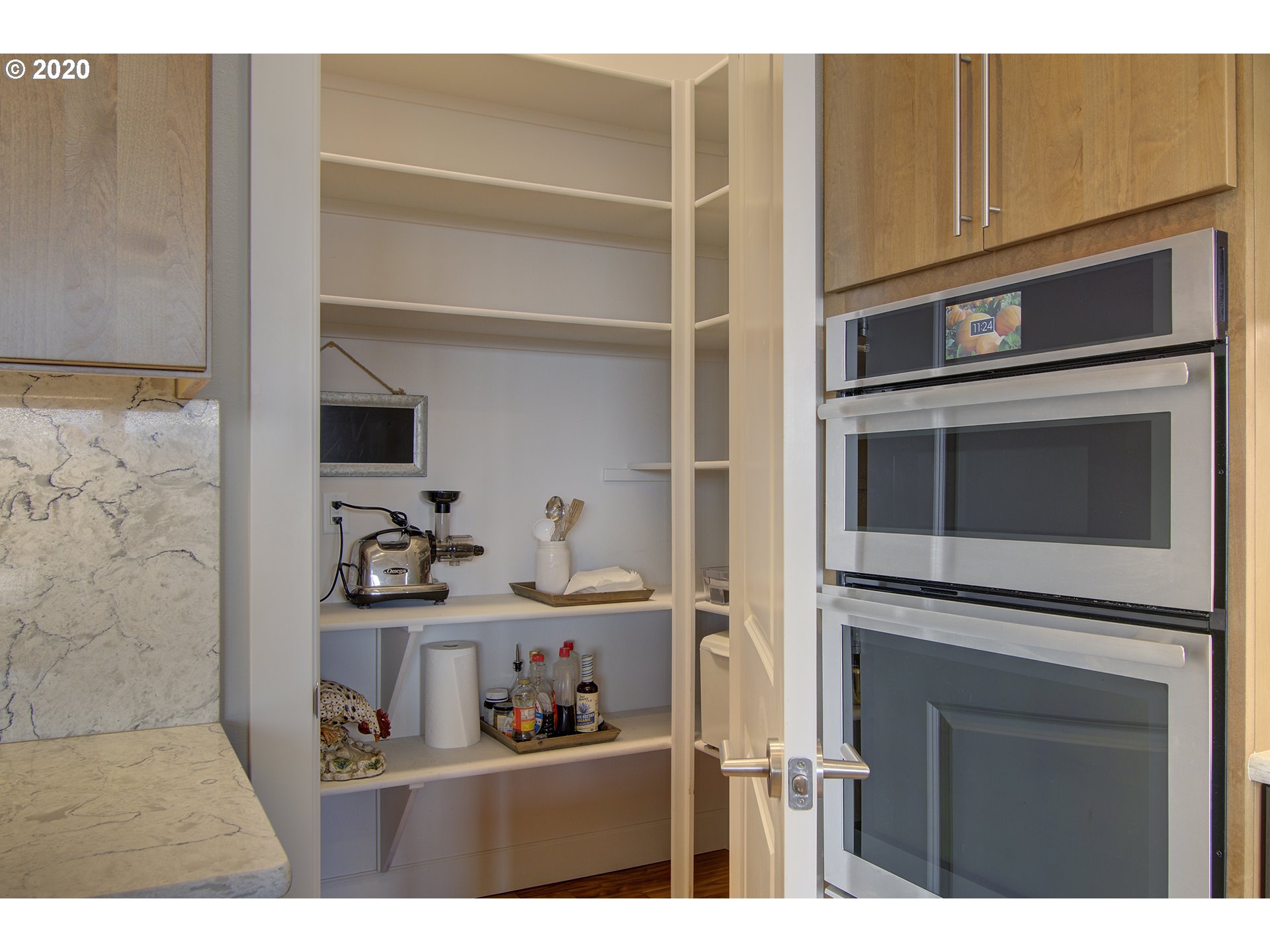 3221 Northwest Lake Place Camas, WA 98607 - Photo 9 of 32 a kitchen with white cabinets and appliances