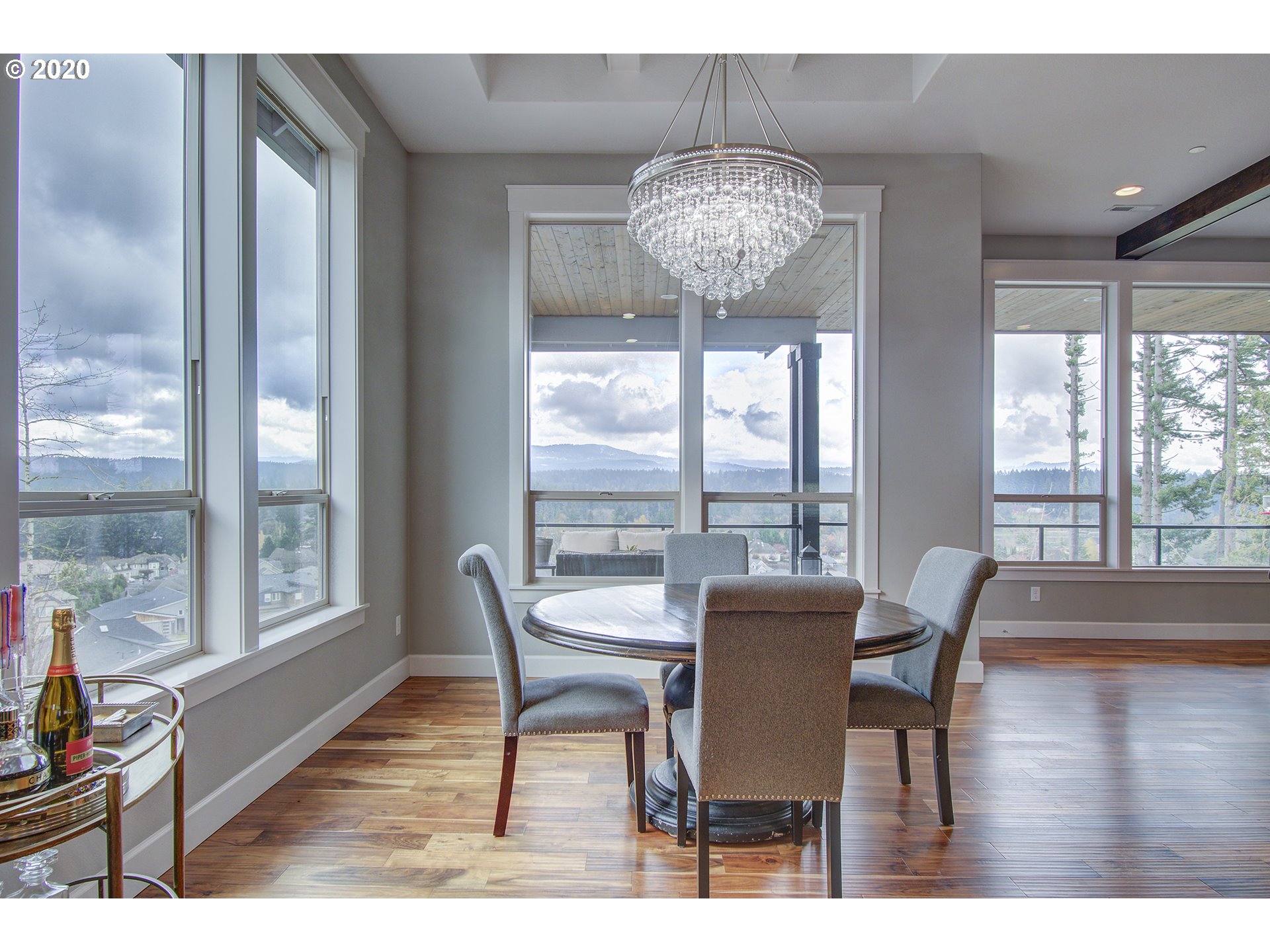 3221 Northwest Lake Place Camas, WA 98607 - Photo 10 of 32 a view of a dining room with furniture wooden floor and chandelier