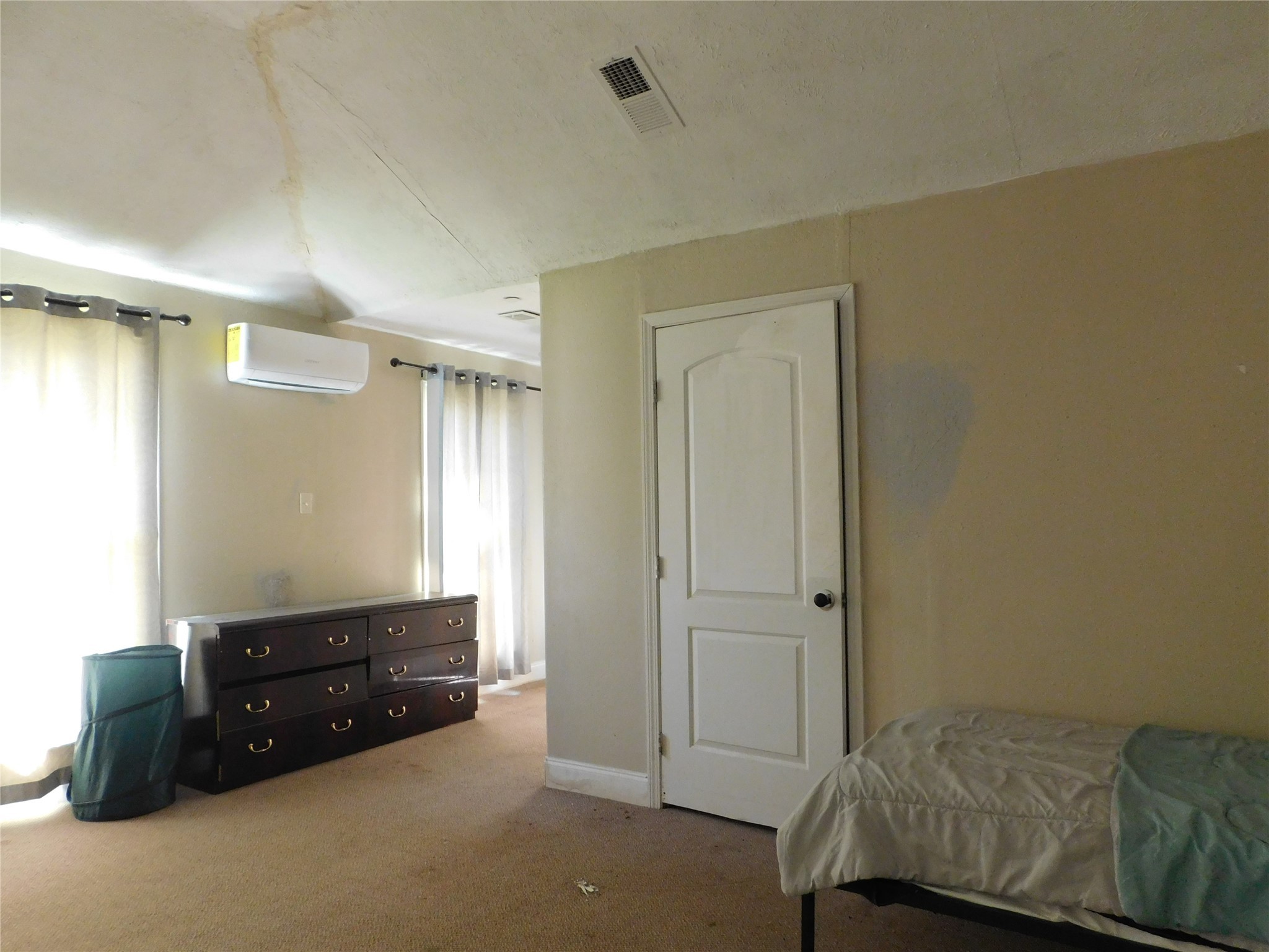 13203 Highway 59 Kendleton, TX 77451 - Photo 12 of 38 a room with a bed and a dresser