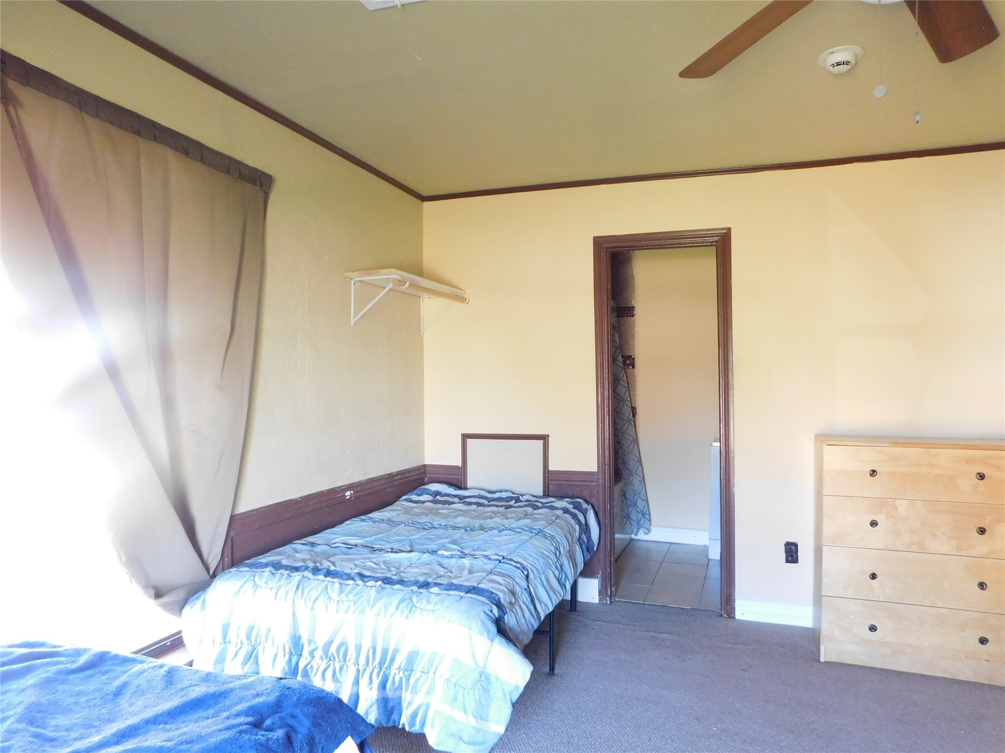 13203 Highway 59 Kendleton, TX 77451 - Photo 16 of 38 a bedroom with a bed and a mirror