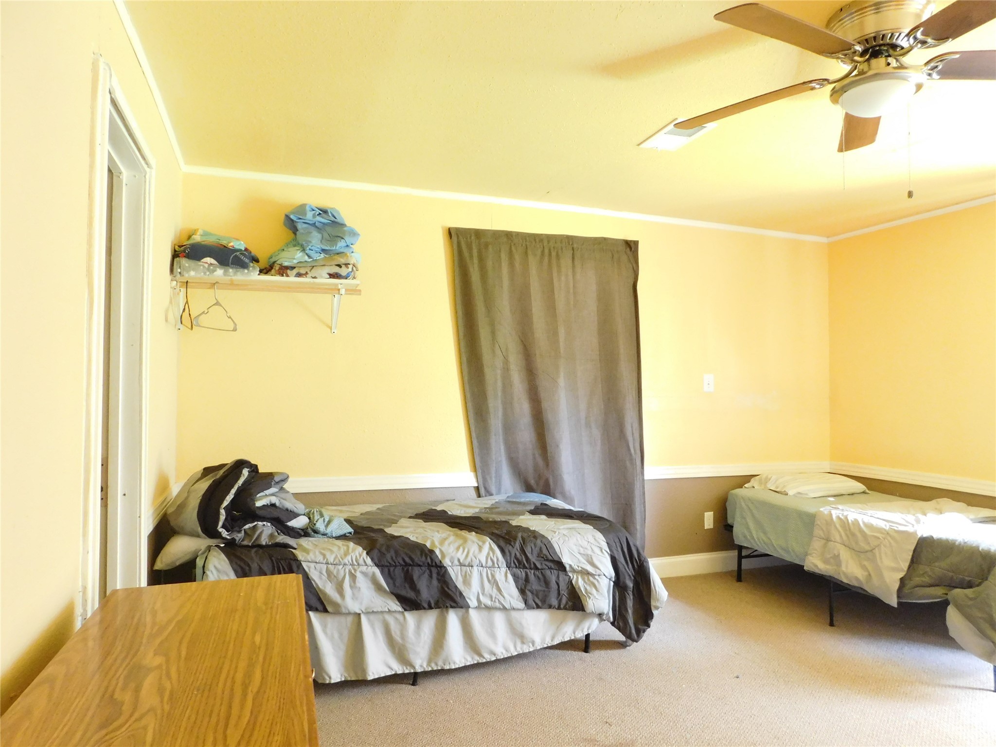 13203 Highway 59 Kendleton, TX 77451 - Photo 18 of 38 a bedroom with a bed and a window