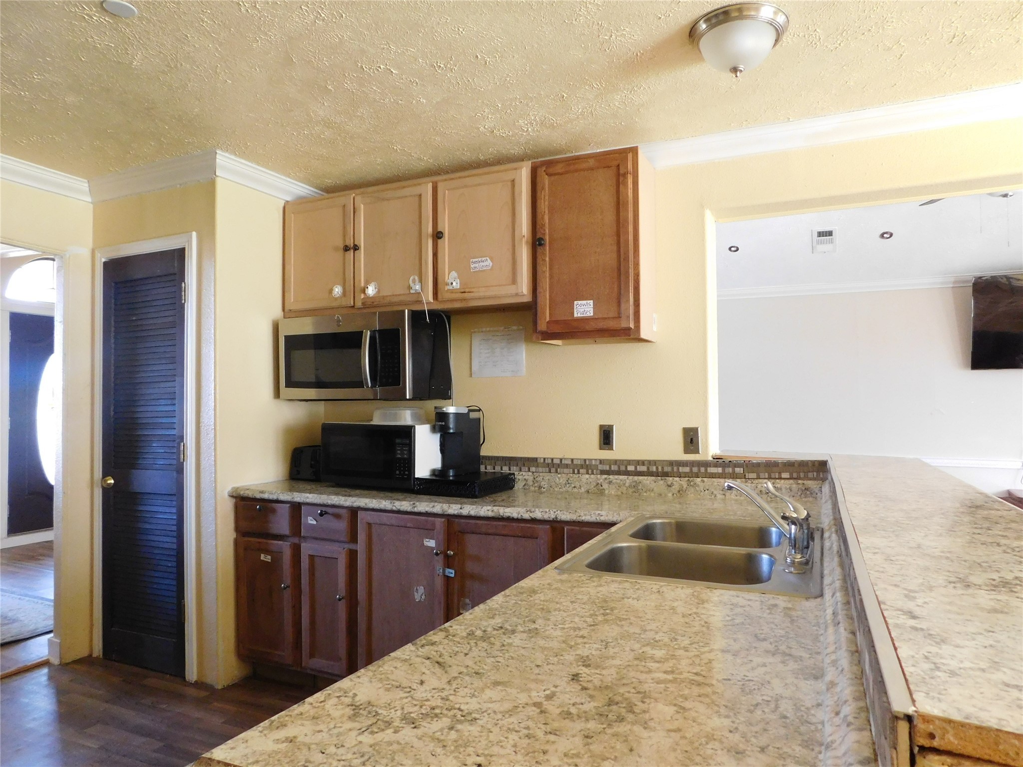 13203 Highway 59 Kendleton, TX 77451 - Photo 22 of 38 a kitchen with stainless steel appliances granite countertop a sink stove and refrigerator