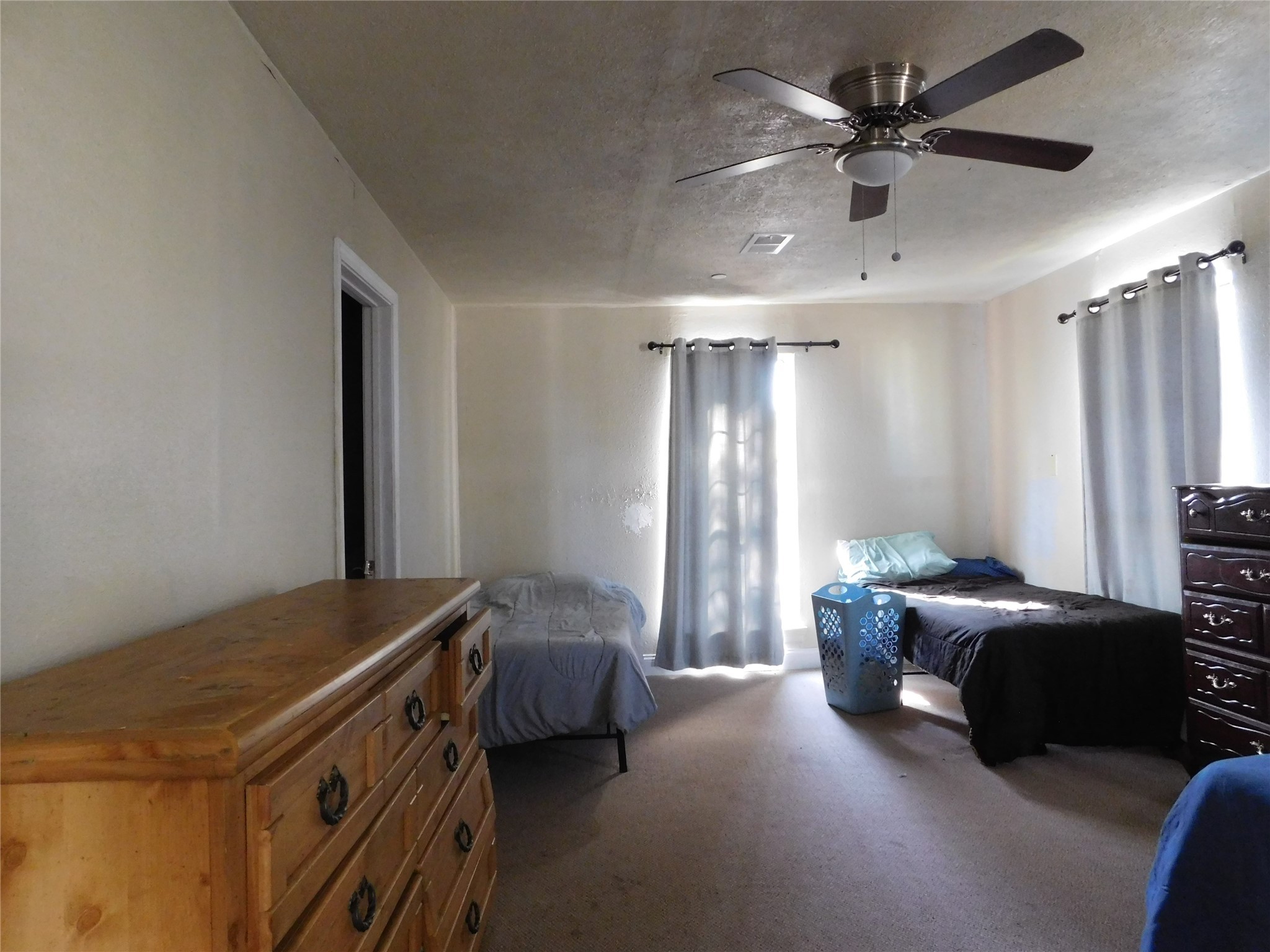 13203 Highway 59 Kendleton, TX 77451 - Photo 24 of 38 a bedroom with a bed and a chandelier