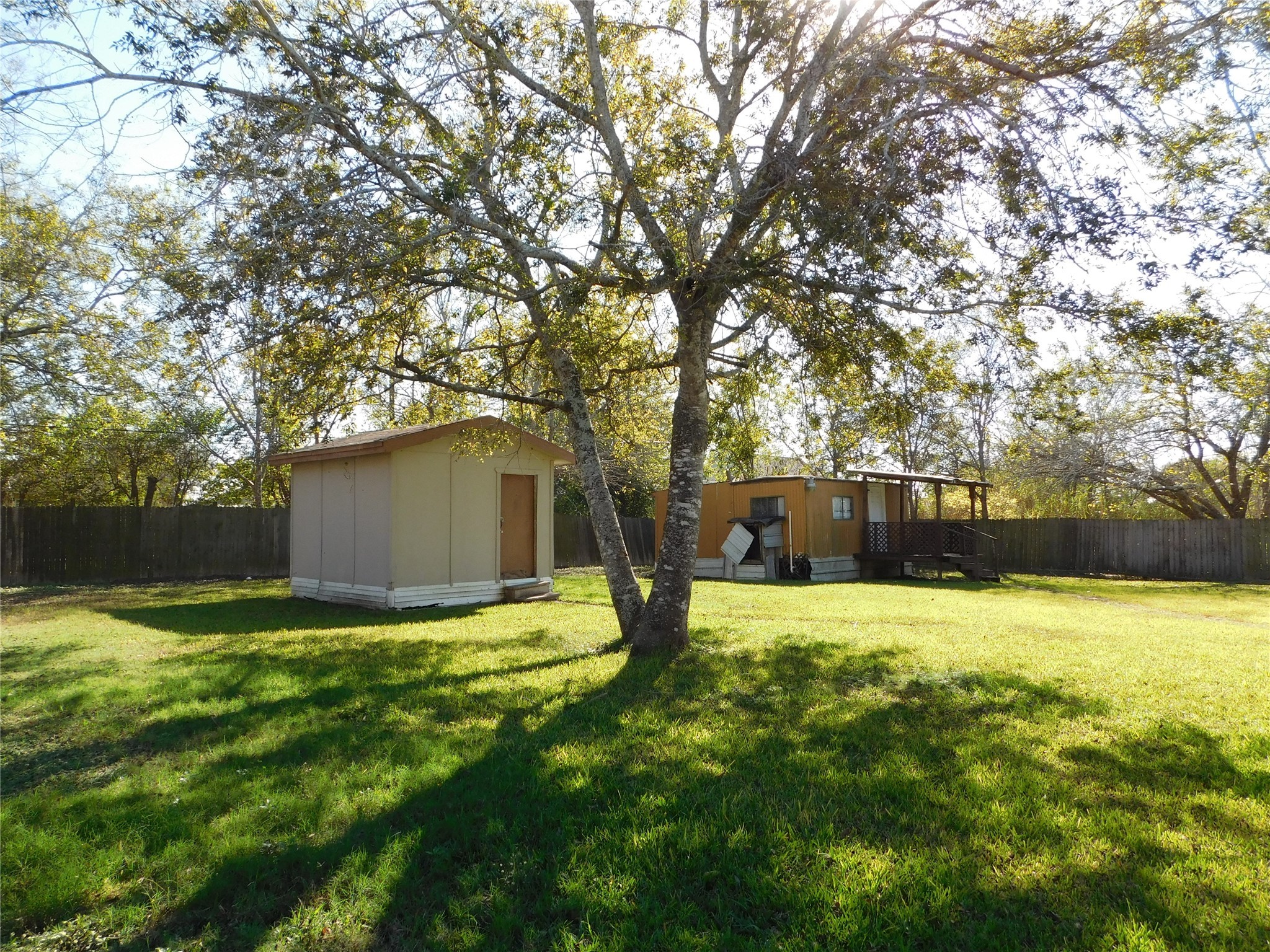 13203 Highway 59 Kendleton, TX 77451 - Photo 27 of 38 a house with yard and a large tree