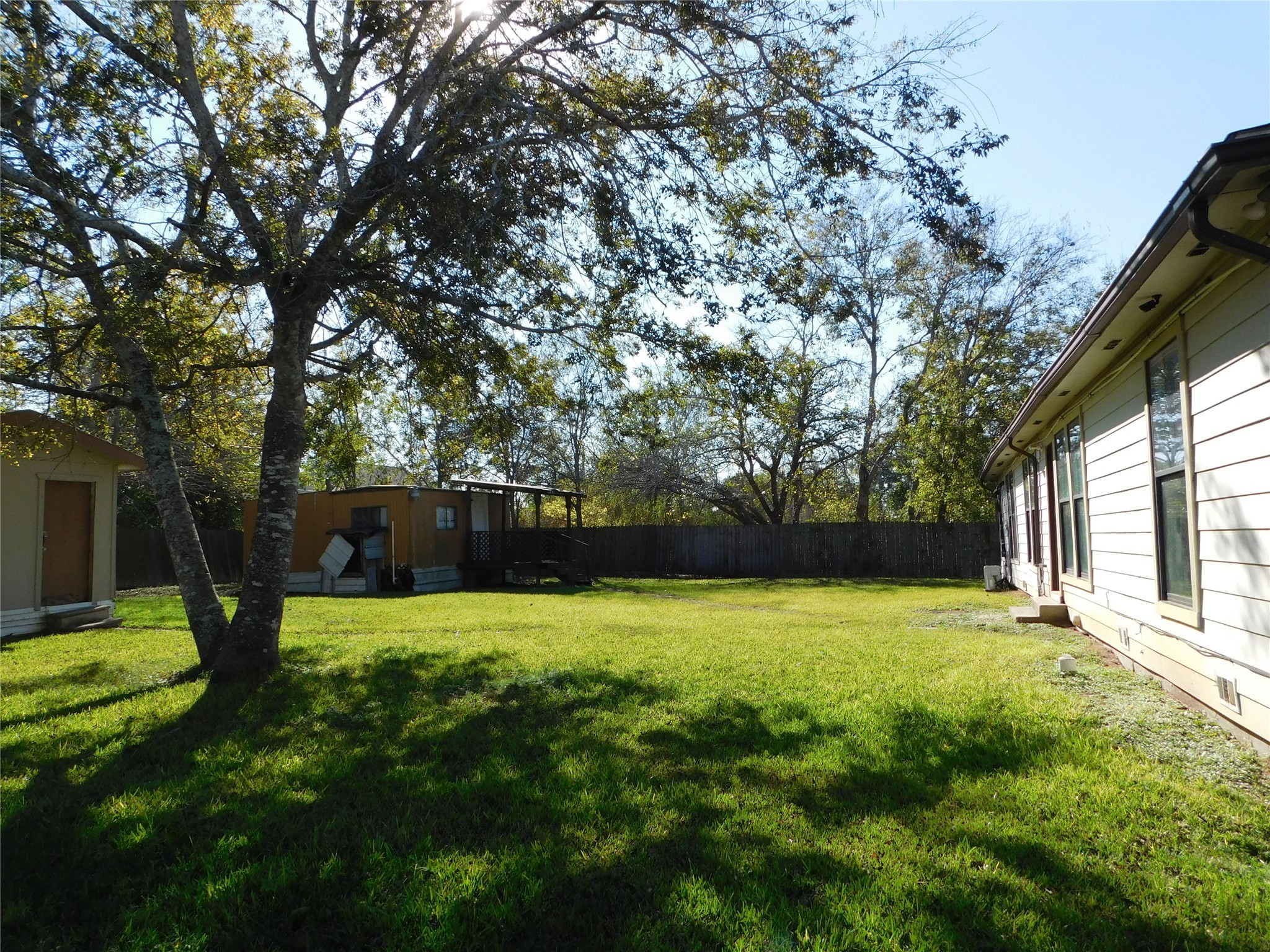 13203 Highway 59 Kendleton, TX 77451 - Photo 29 of 38 a view of a backyard with a small cabin