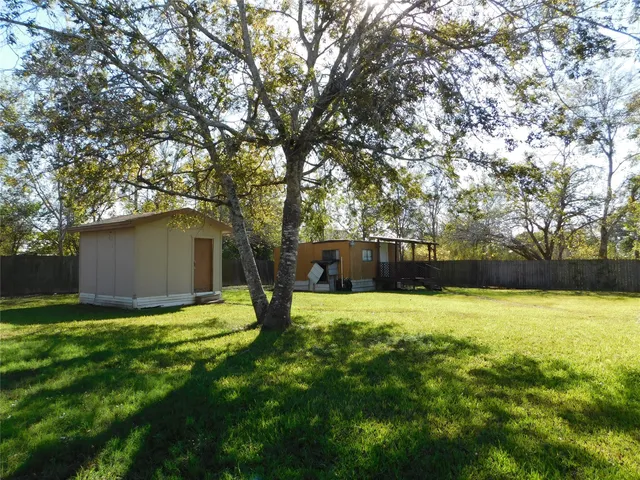 a view of a backyard with a garden