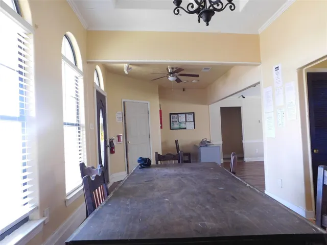 a view of a hallway view with furniture and windows