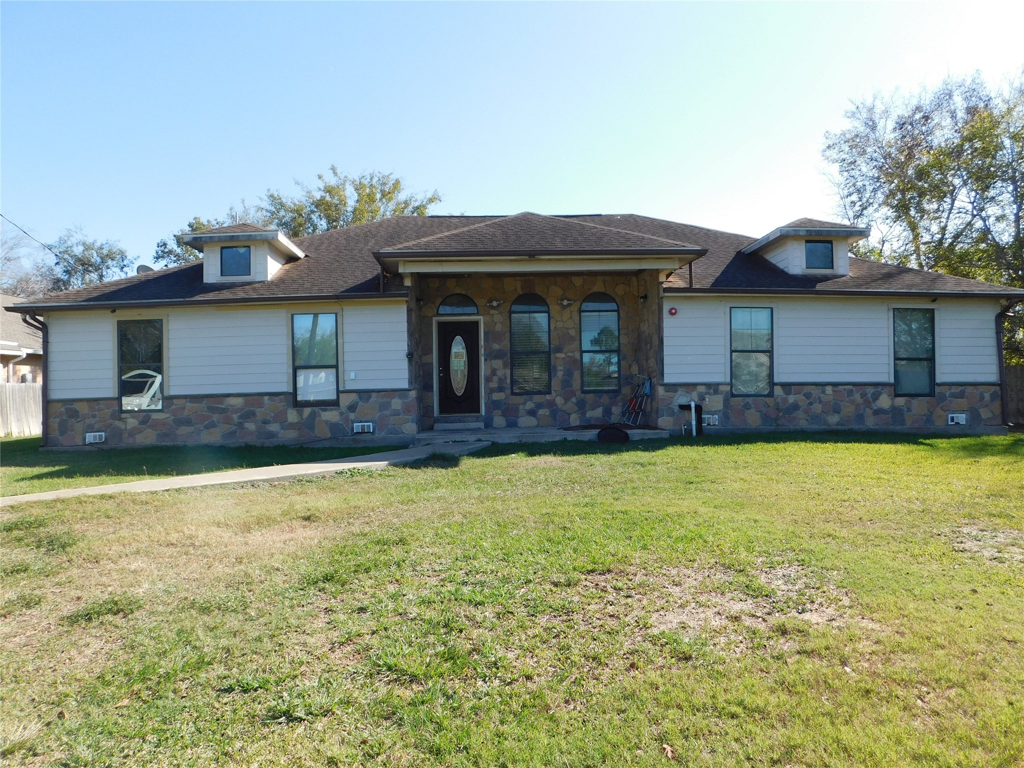 13203 Highway 59 Kendleton, TX 77451 - Photo 38 of 38 a front view of house with yard and trees in the background