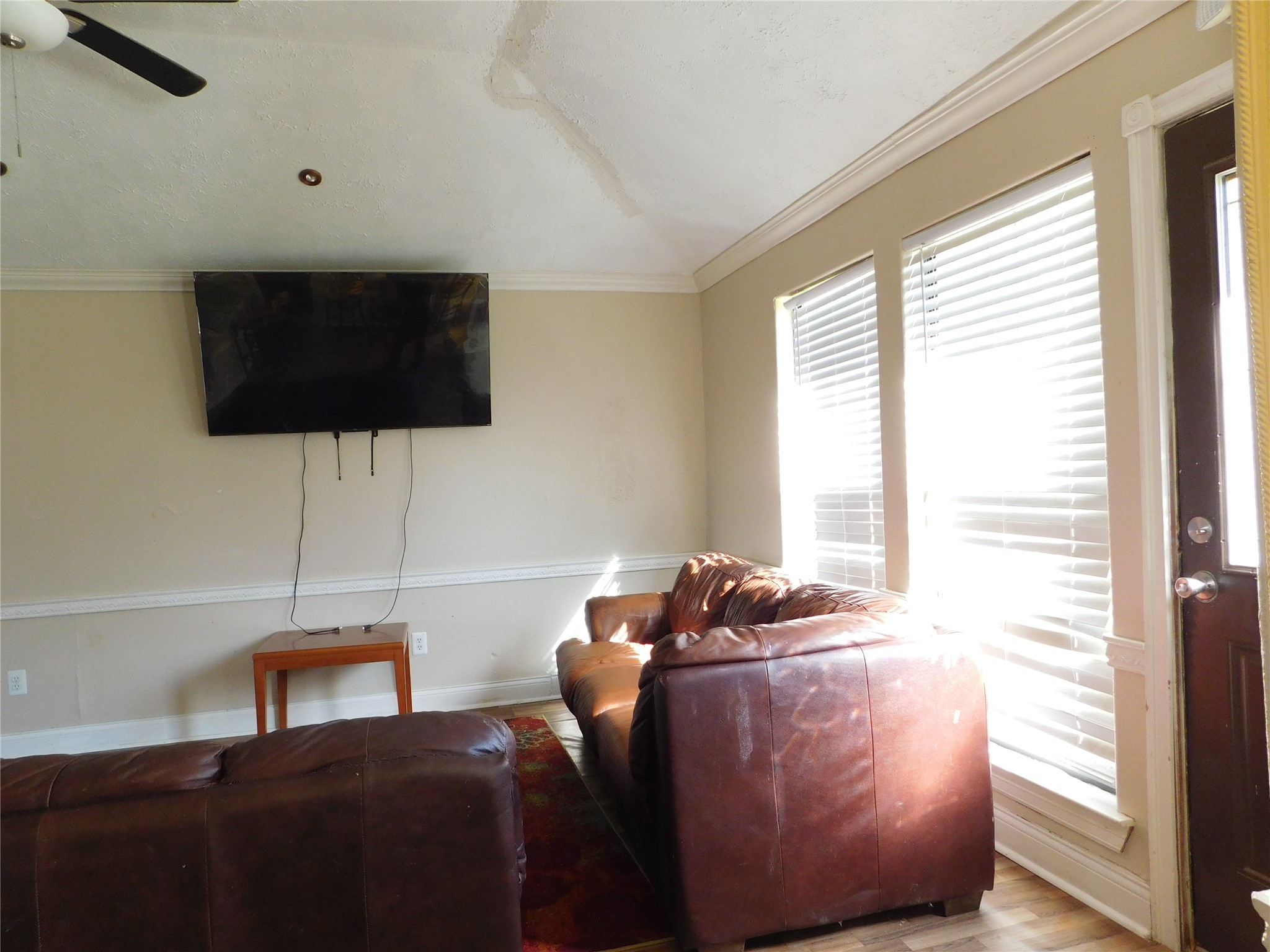 13203 Highway 59 Kendleton, TX 77451 - Photo 7 of 38 a living room with furniture and a flat screen tv