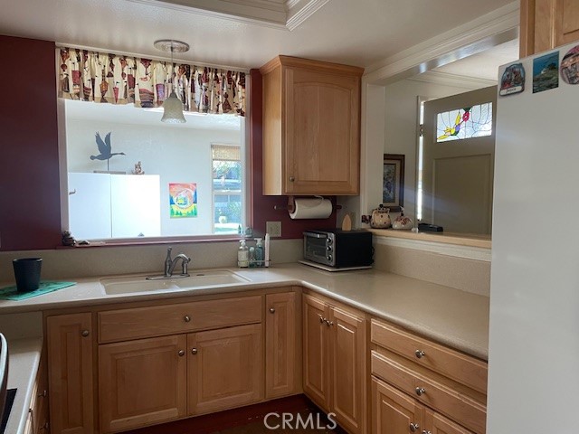 13360 Del Monte Drive, Unit 2B Seal Beach, CA 90740 - Photo 12 of 28 a kitchen with a sink and cabinets