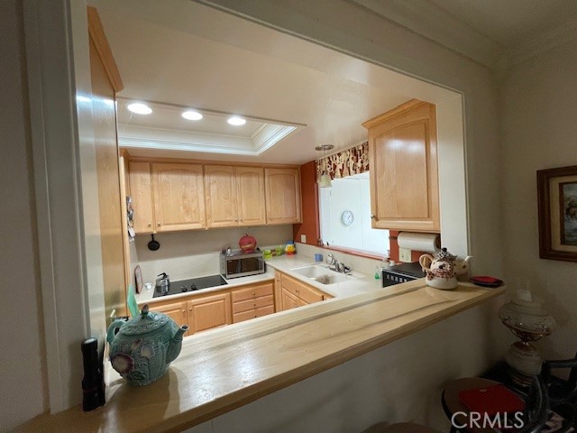 13360 Del Monte Drive, Unit 2B Seal Beach, CA 90740 - Photo 14 of 28 a kitchen with a sink cabinets and a large window
