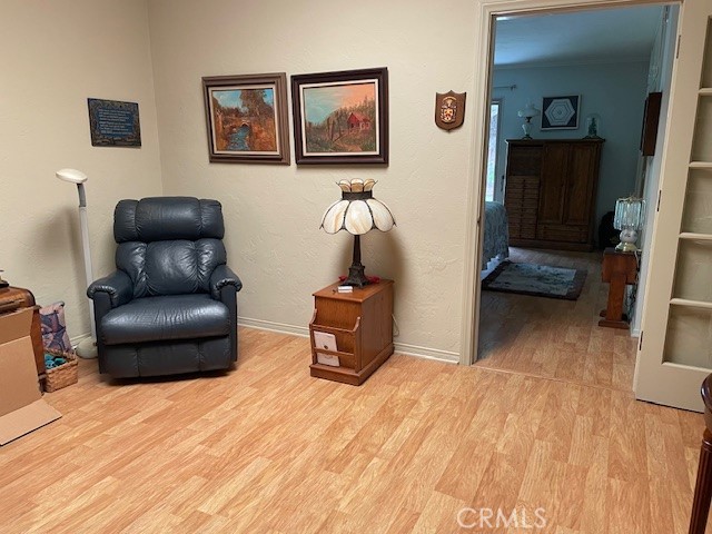 13360 Del Monte Drive, Unit 2B Seal Beach, CA 90740 - Photo 17 of 28 a room with furniture and a wooden floor