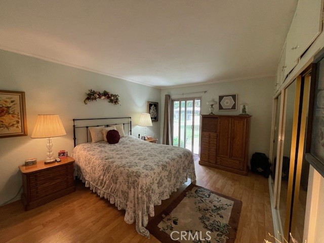 13360 Del Monte Drive, Unit 2B Seal Beach, CA 90740 - Photo 18 of 28 a bedroom with a bed dresser and a window