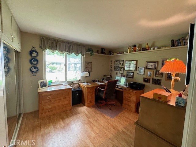 13360 Del Monte Drive, Unit 2B Seal Beach, CA 90740 - Photo 20 of 28 a living room with furniture a rug kitchen view and large windows