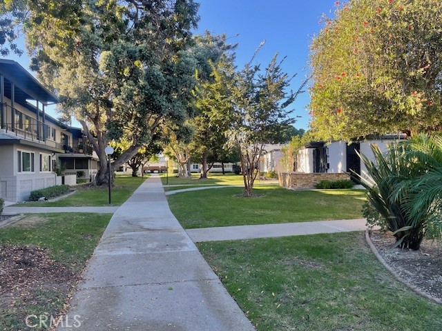 13360 Del Monte Drive, Unit 2B Seal Beach, CA 90740 - Photo 2 of 28 a park view with large trees