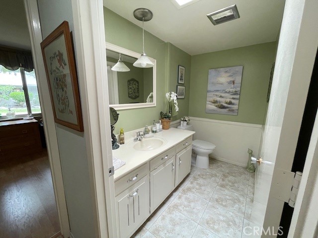 13360 Del Monte Drive, Unit 2B Seal Beach, CA 90740 - Photo 21 of 28 a bathroom with a double vanity sink toilet and shower
