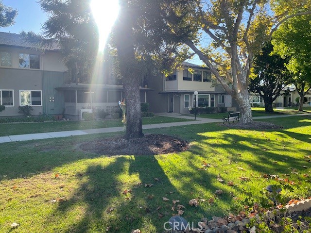 13360 Del Monte Drive, Unit 2B Seal Beach, CA 90740 - Photo 27 of 28 a view of a house with a yard