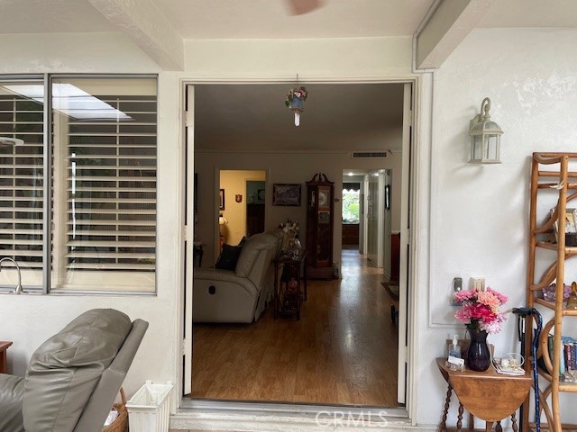 13360 Del Monte Drive, Unit 2B Seal Beach, CA 90740 - Photo 5 of 28 a living room with furniture and a potted plant