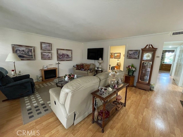 13360 Del Monte Drive, Unit 2B Seal Beach, CA 90740 - Photo 7 of 28 a bed room with furniture a flat screen tv and a dresser