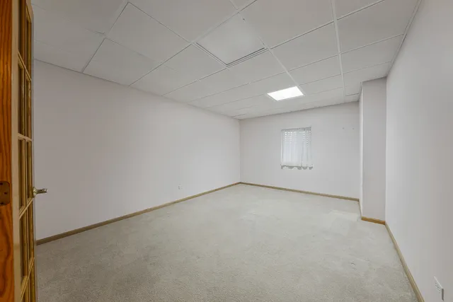 a view of an empty room and a window