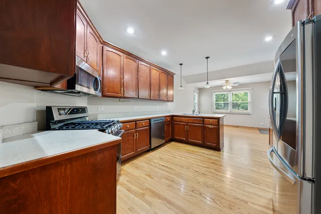 a view of an empty room with chandelier