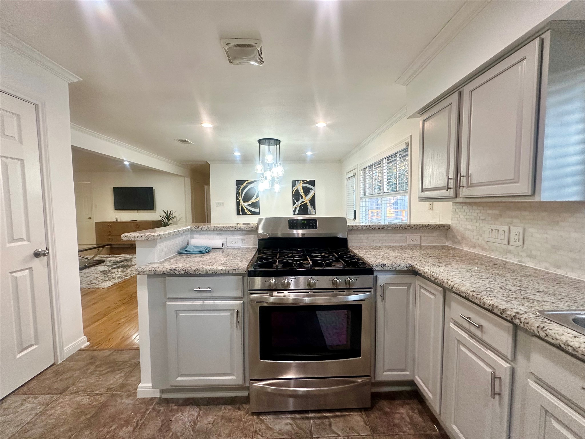 5329 Pagewood Lane Houston, TX 77056 - Photo 7 of 18 a kitchen with stainless steel appliances granite countertop a stove and a sink
