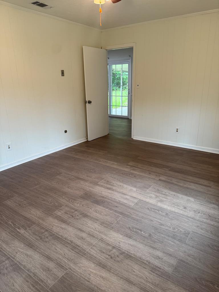 4355 Byron Street Columbus, GA 31907 - Photo 13 of 20 an empty room with wooden floor and windows