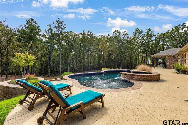 a view of a backyard with sitting area