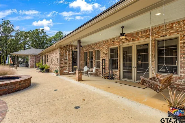 a view of a house with outdoor seating