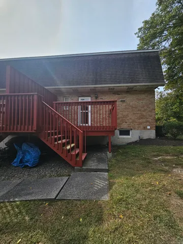 a view of a deck with a yard