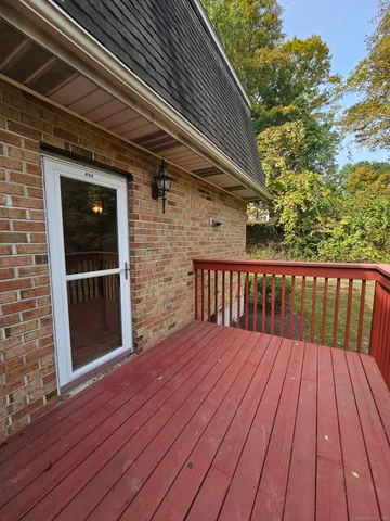 a balcony view with a hardwood floor