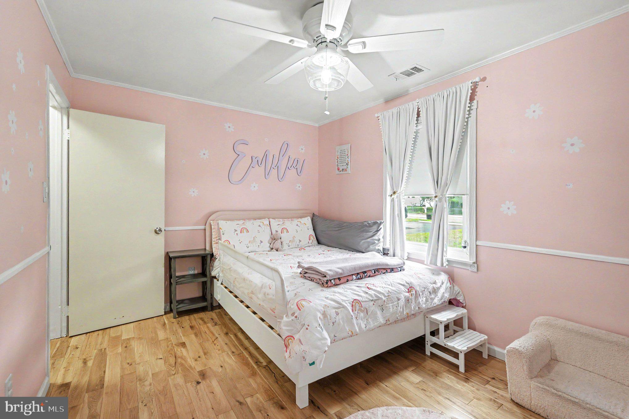 8853 Olde Mill Run Road Manassas, VA 20110 - Photo 13 of 29 Charming pink bedroom for sweet dreams.