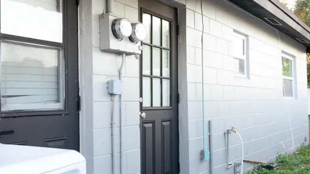 a bathroom with a light fixture and a shower
