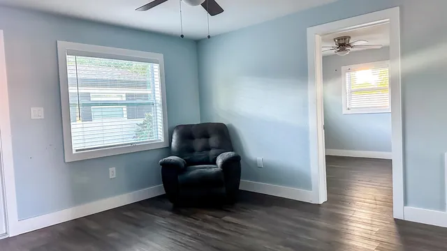 a living room with furniture and a window