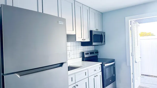 a kitchen with a stove and a microwave