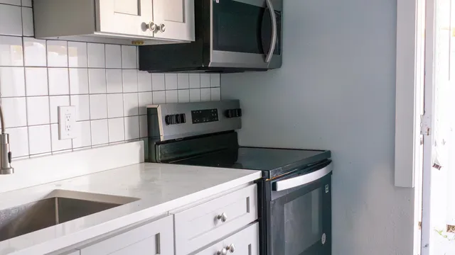 a kitchen with a sink and cabinets