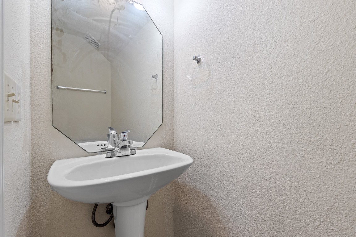 102 Orange Tree Lane Georgetown, TX 78626 - Photo 12 of 31 a bathroom with a sink and a mirror