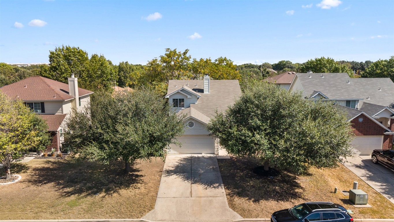 102 Orange Tree Lane Georgetown, TX 78626 - Photo 2 of 31 a aerial view of a house with a yard and mountain view in back