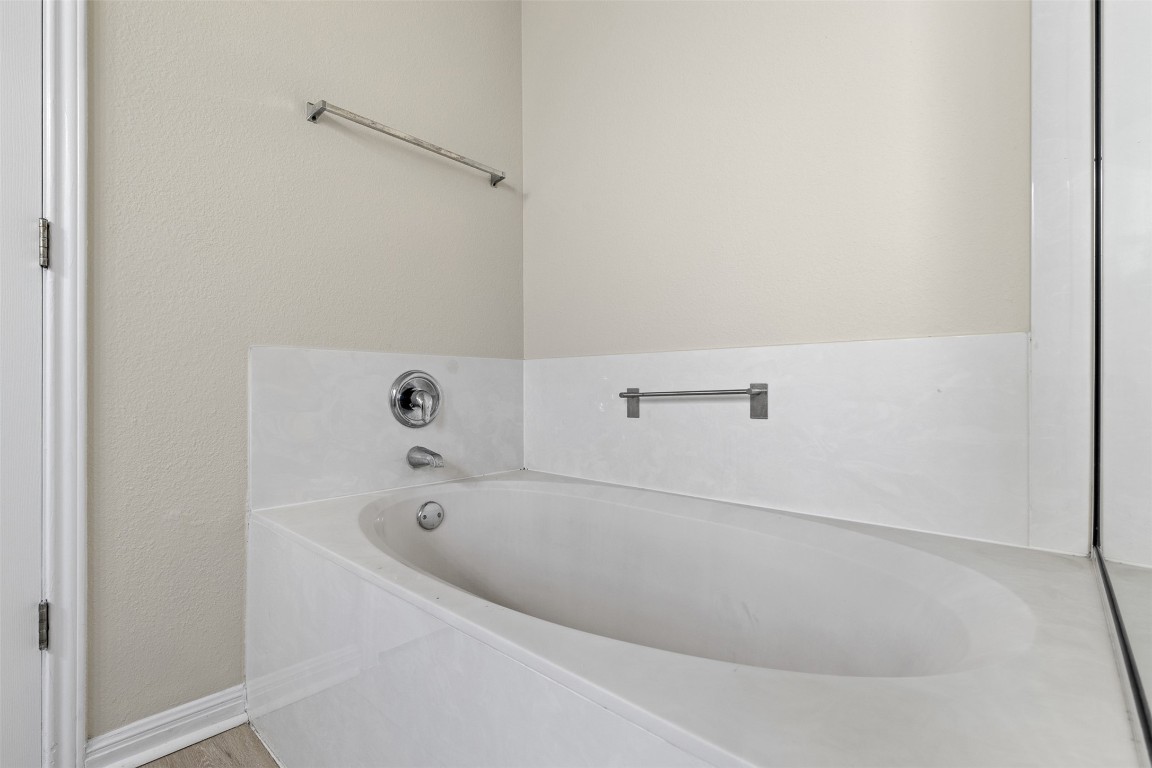 102 Orange Tree Lane Georgetown, TX 78626 - Photo 20 of 31 a white bath tub sitting in a bathroom
