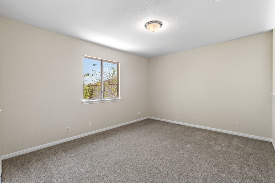 102 Orange Tree Lane Georgetown, TX 78626 - Photo 21 of 31 an empty room with a window